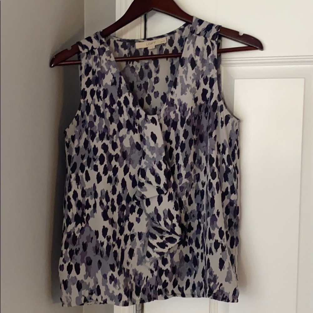 Size Small Petite. Great Spring top.